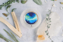 Load image into Gallery viewer, Vintage Victorian Cottagecore Aurora Solid Perfume Compact with Northern Lights Aurora Borealis Watercolor by Artist Aurelia Corvinus
